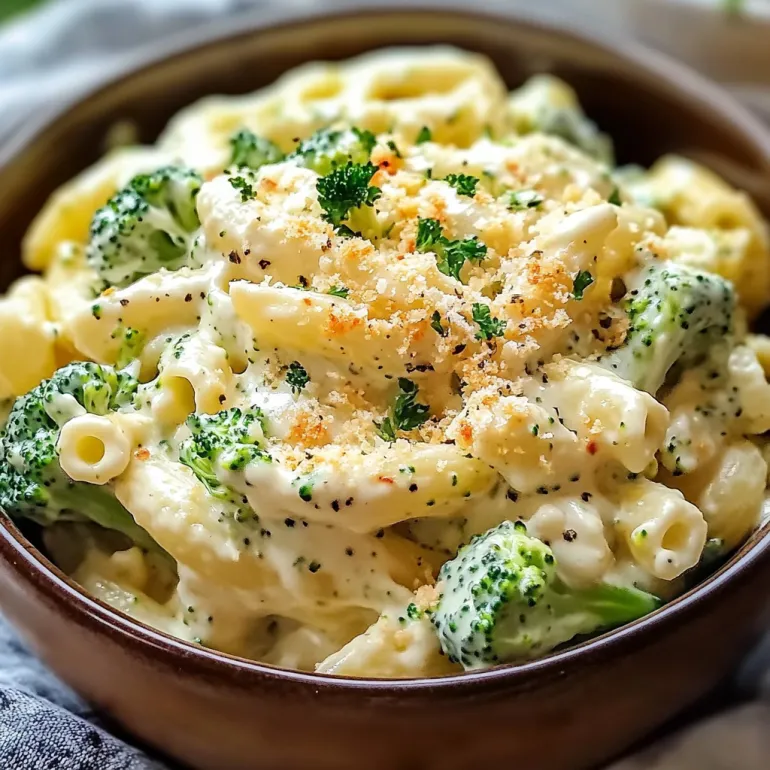 A bowl of creamy pasta with broccoli.