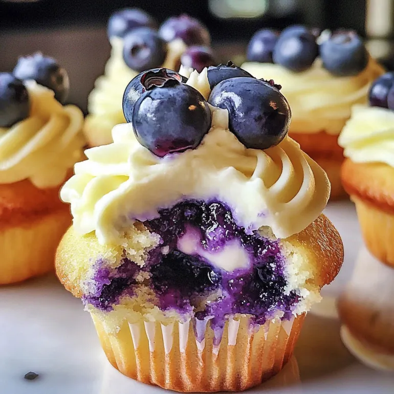 A cupcake with blueberries and lime cheesecake.